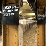 Two more of the "Aretha" Franklin Street signs, also located on the northbound side of the station